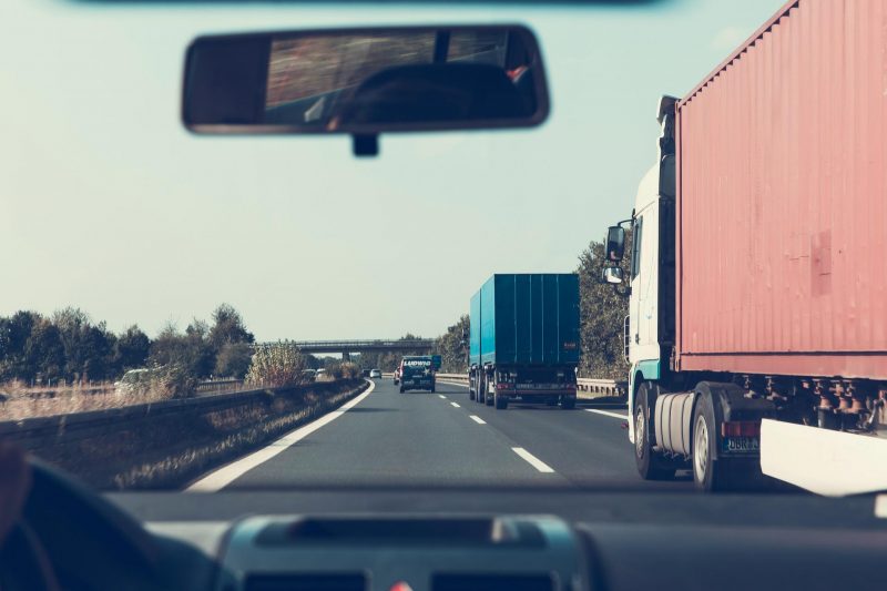 image of the road taken from inside the front of a moving vehicle