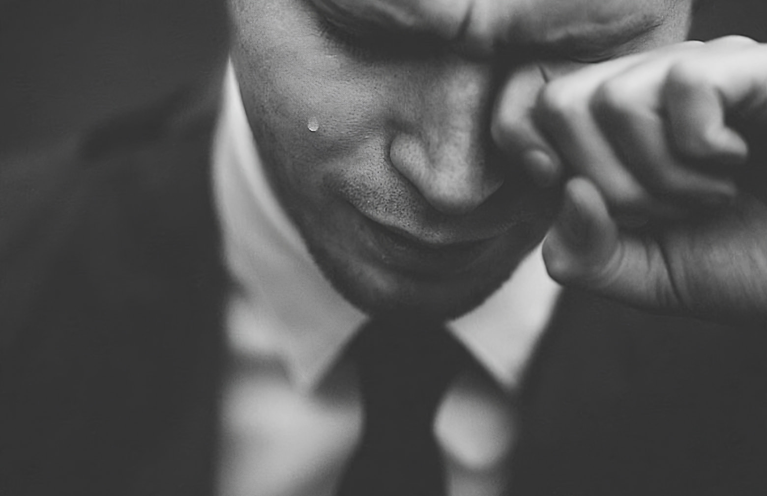 image of black and white image of a man crying